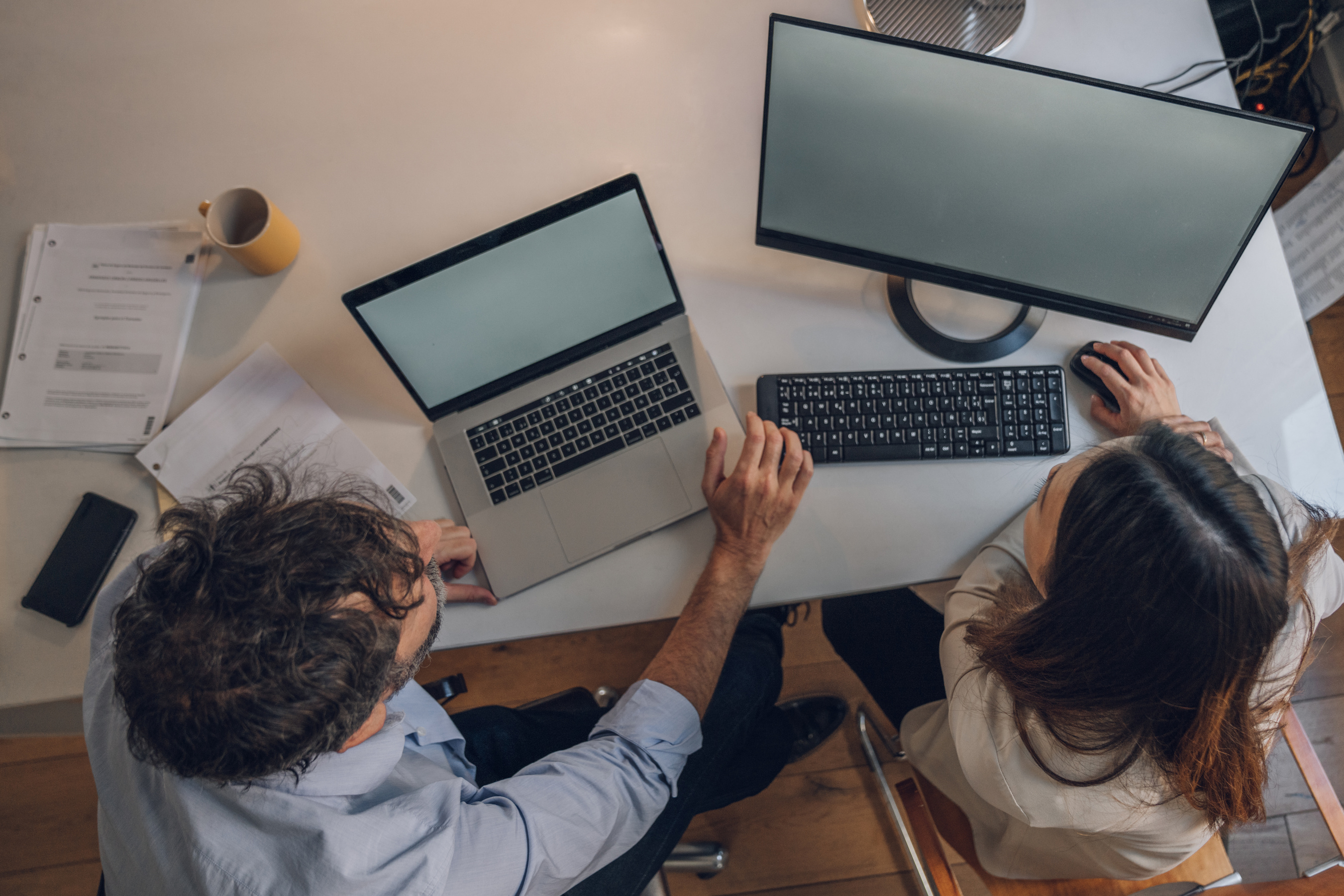 IT Team working together on a computer